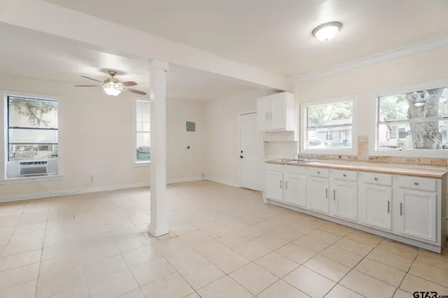 a view of a kitchen with marble kitchen and sink