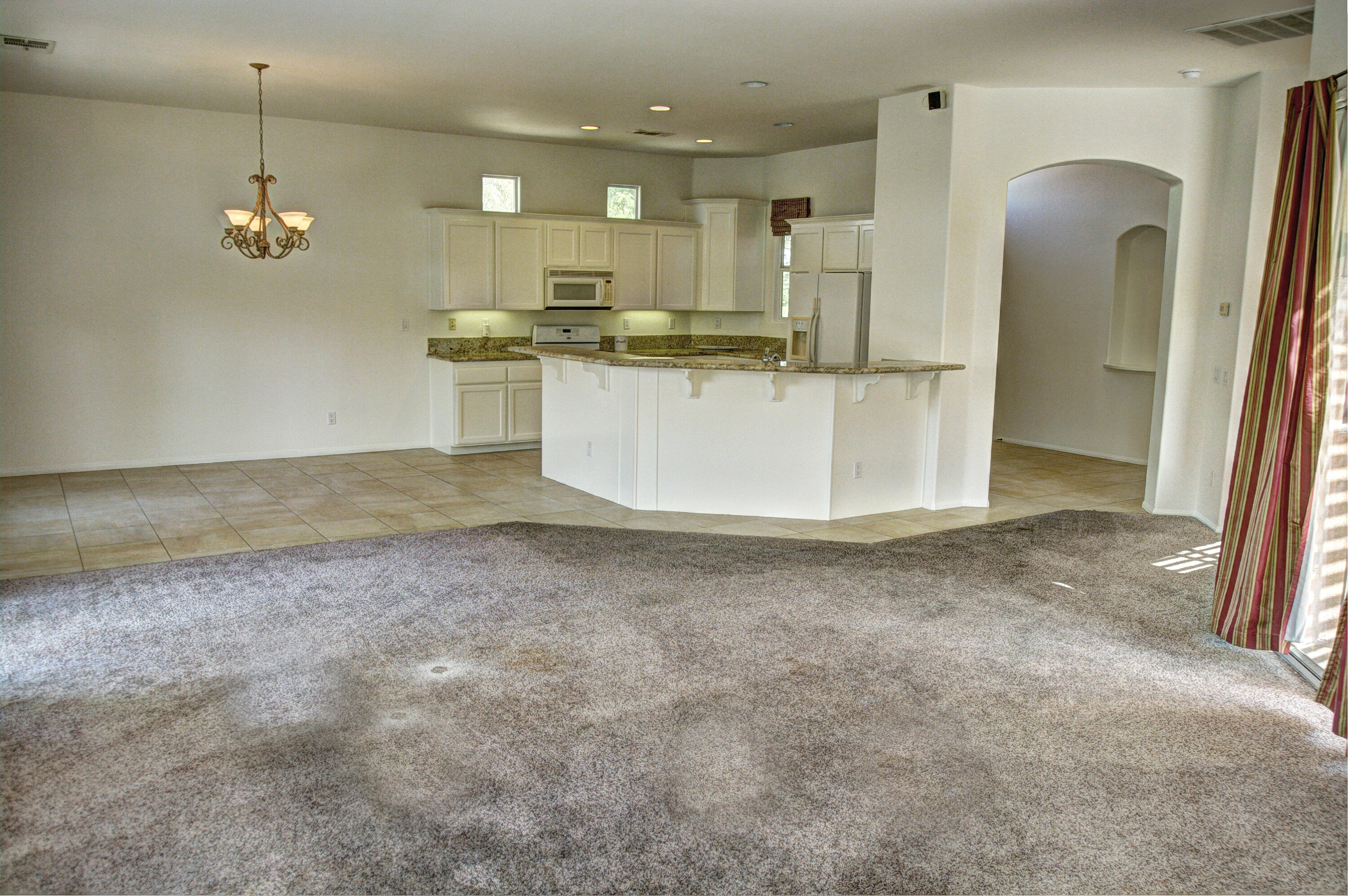 82531 Alda Drive Indio, CA 92201 - Photo 3 of 32 a view of a kitchen with a sink and cabinets