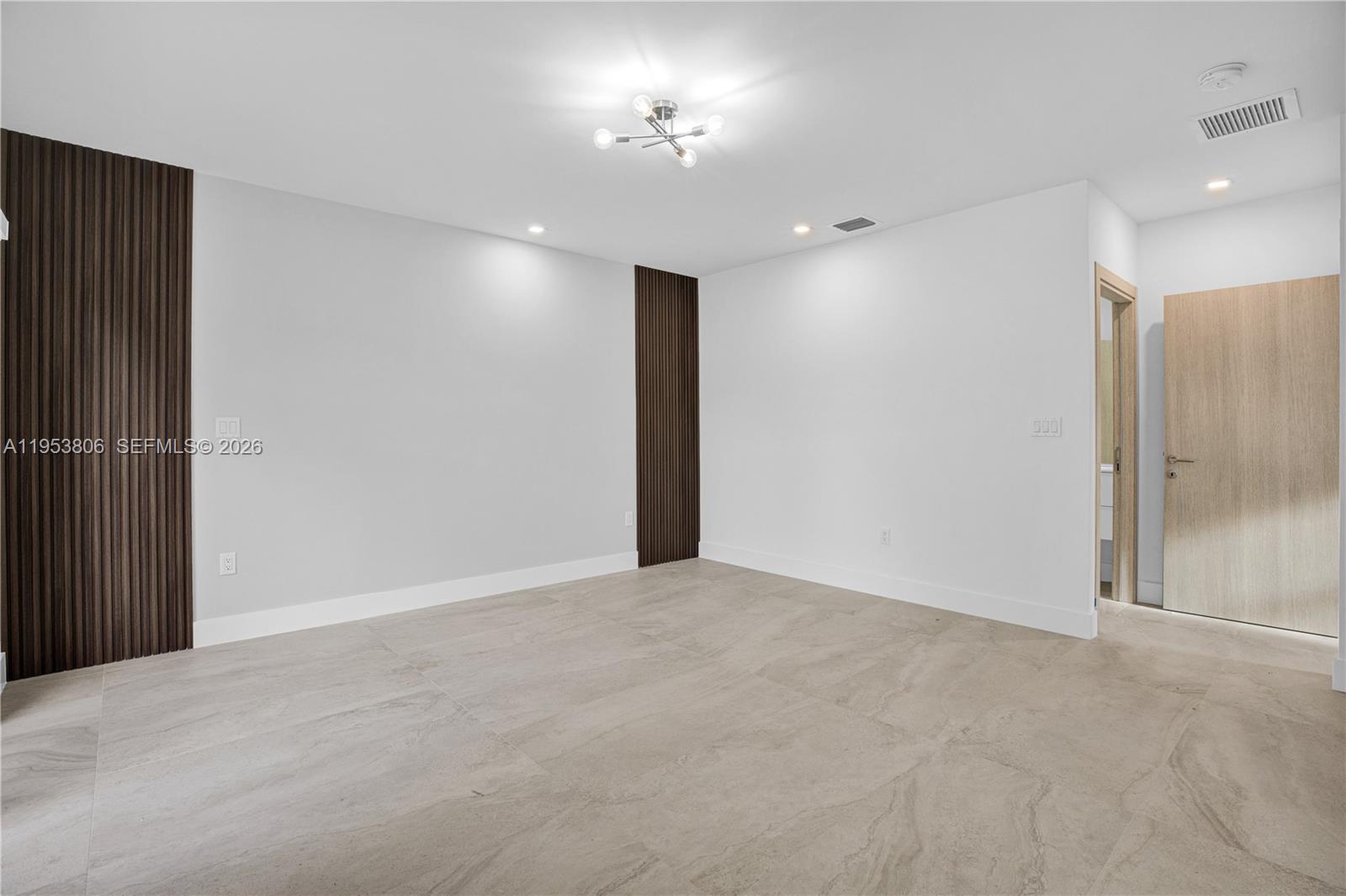 3433 Southwest 16th Terrace Miami, FL 33145 - Photo 12 of 26 a view of an empty room with a mirror