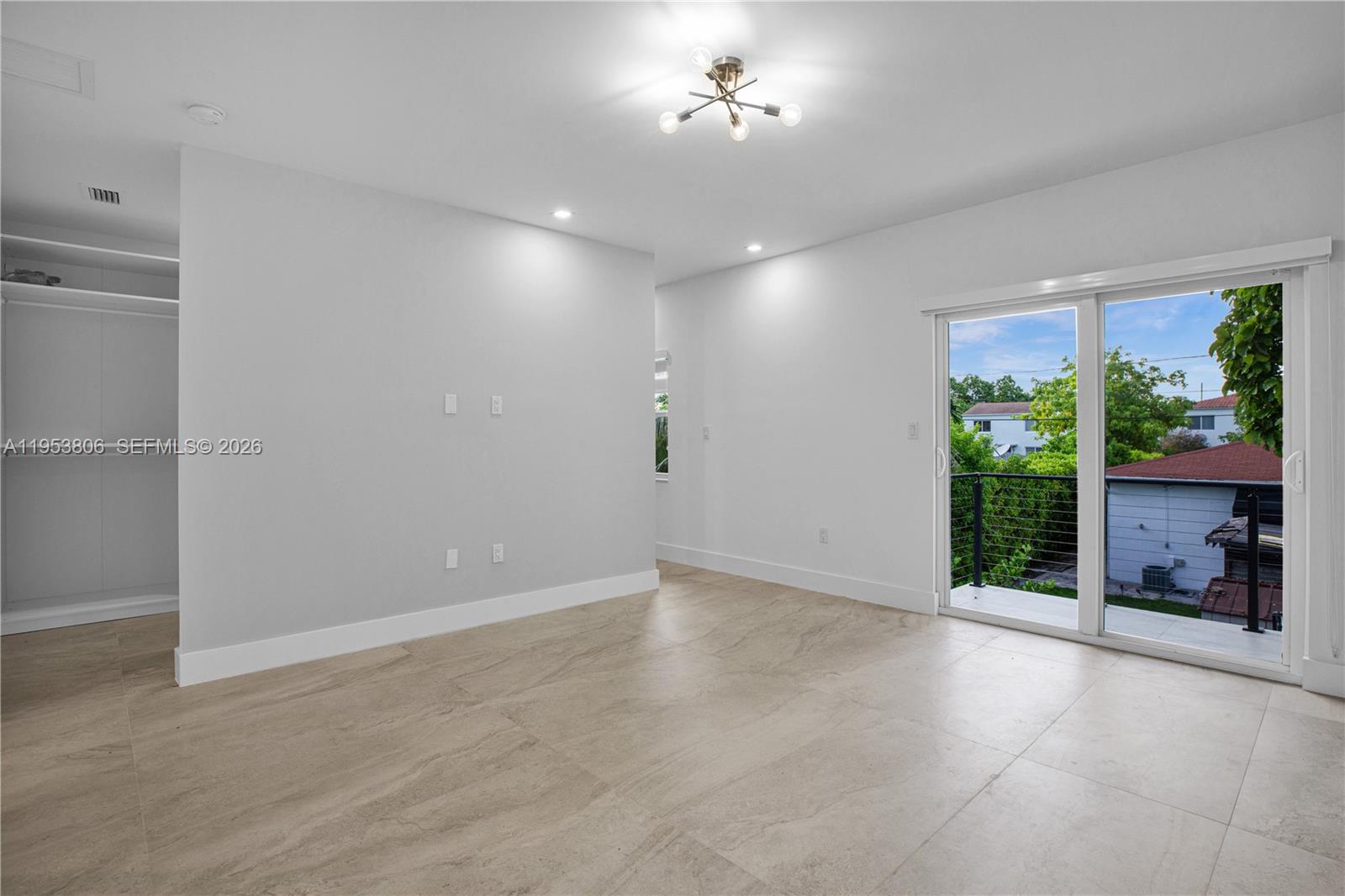 3433 Southwest 16th Terrace Miami, FL 33145 - Photo 13 of 26 an empty room with windows and fireplace
