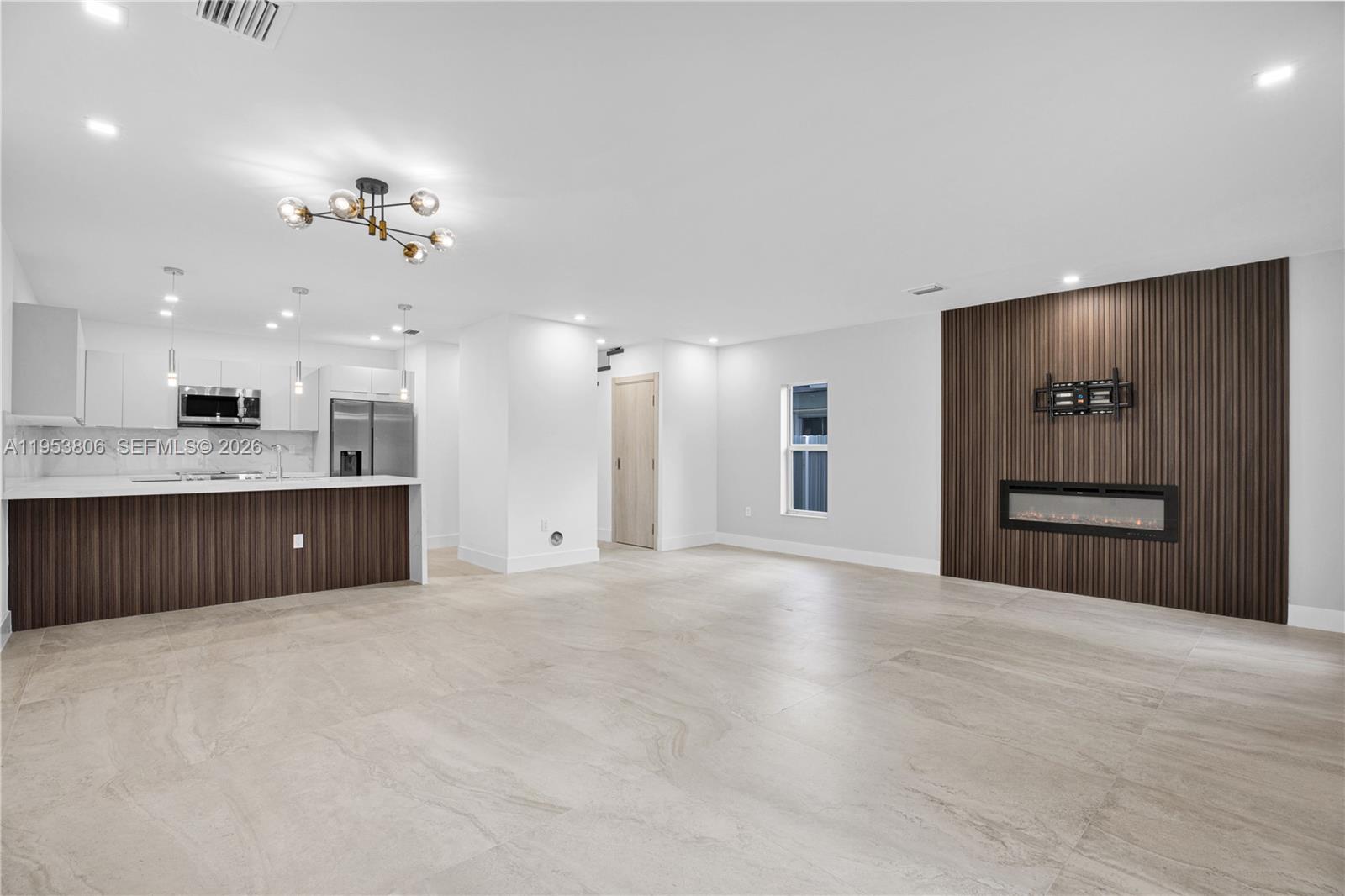 3433 Southwest 16th Terrace Miami, FL 33145 - Photo 4 of 26 a view of a kitchen with a sink and a kitchen island