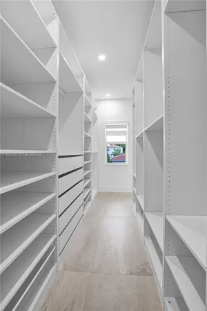 a view of an empty walk in closet