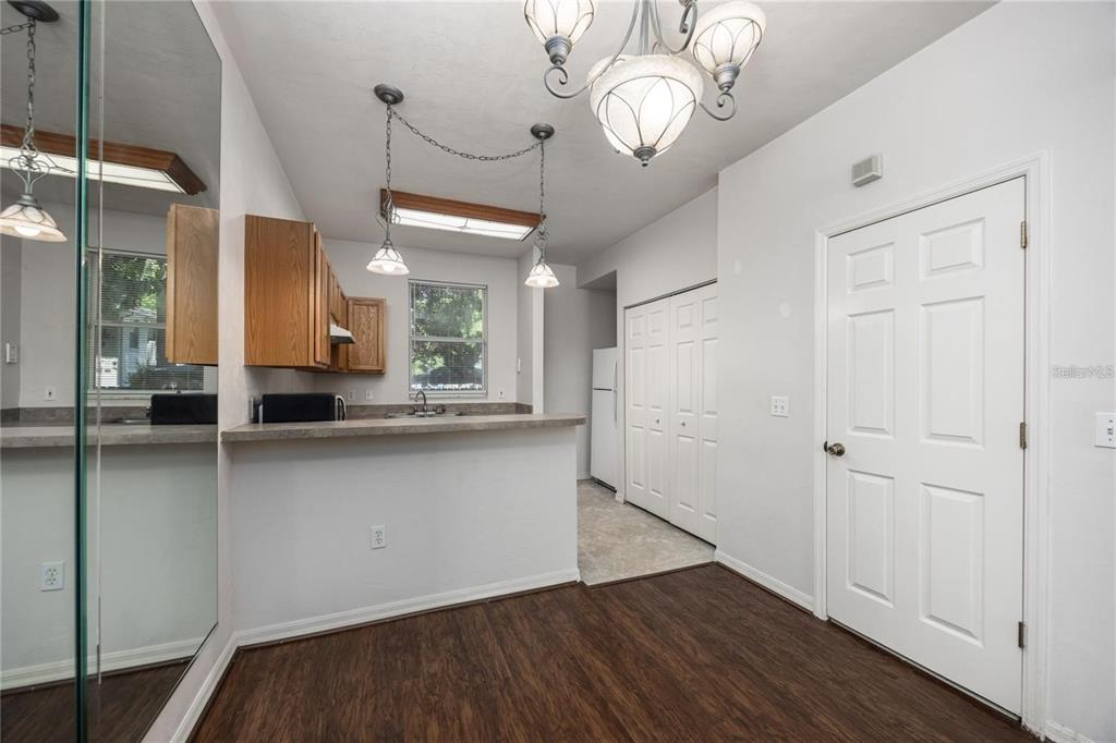 3510 Southwest 30th Way, Unit 158 Gainesville, FL 32608 - Photo 11 of 27 a view of a kitchen from the hallway