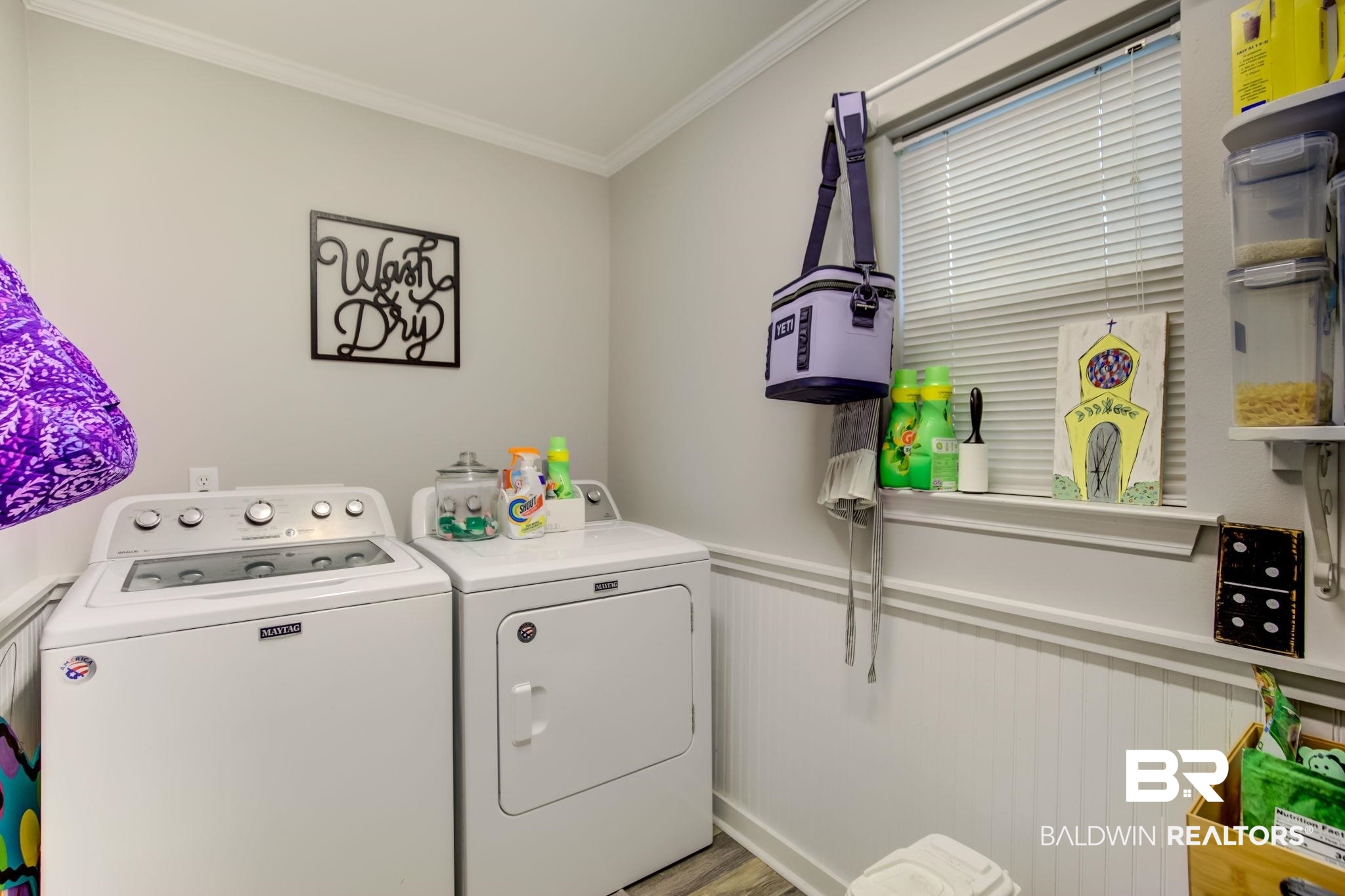 18732 Fairground Road Robertsdale, AL 36567 - Photo 21 of 46 Washroom with crown molding, separate washer and dryer, and light hardwood / wood-style floors