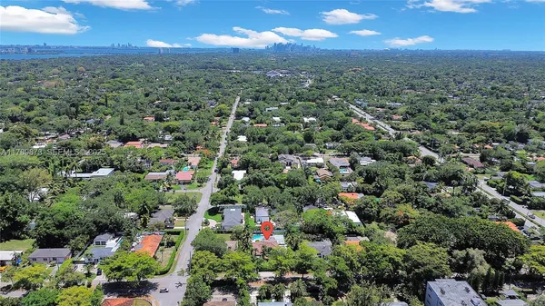 an aerial view of residential houses with outdoor and green space