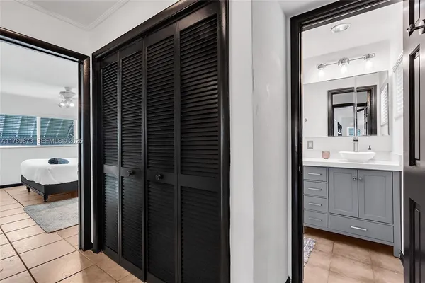 a bedroom with a large bed and a flat screen tv