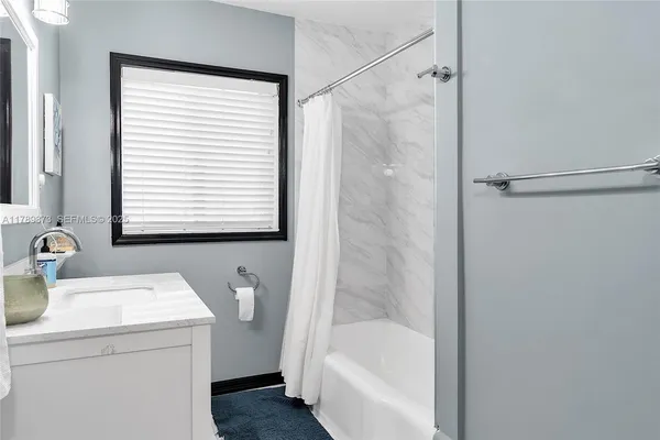 a view of a patio with table and chairs potted plants with wooden fence