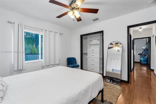 a view of a patio with couches table and chairs and potted plants