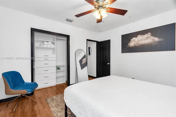 a view of house with yard and sitting area