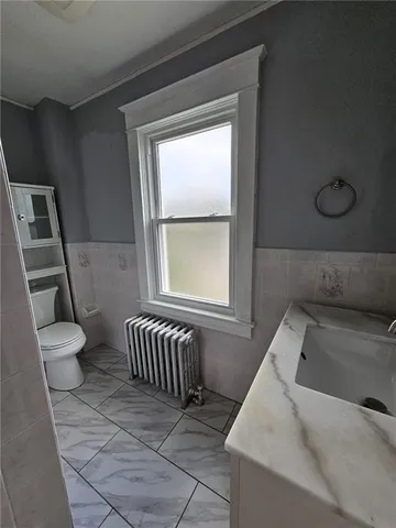 a bathroom with a sink and toilet