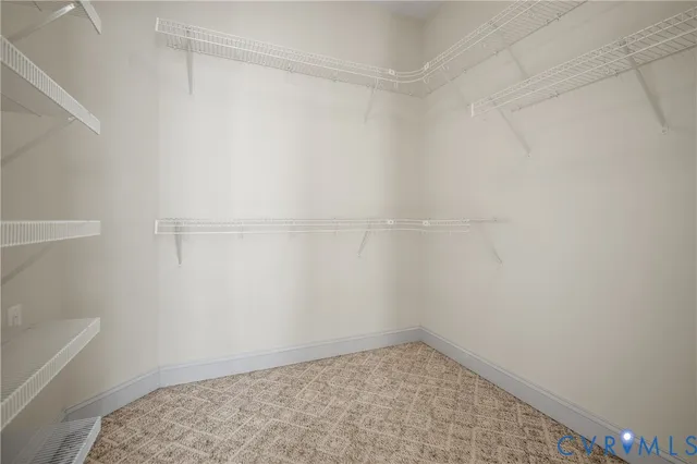 a view of a hallway with washer and dryer