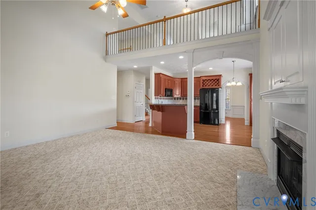 a view of a kitchen with a sink and a fireplace