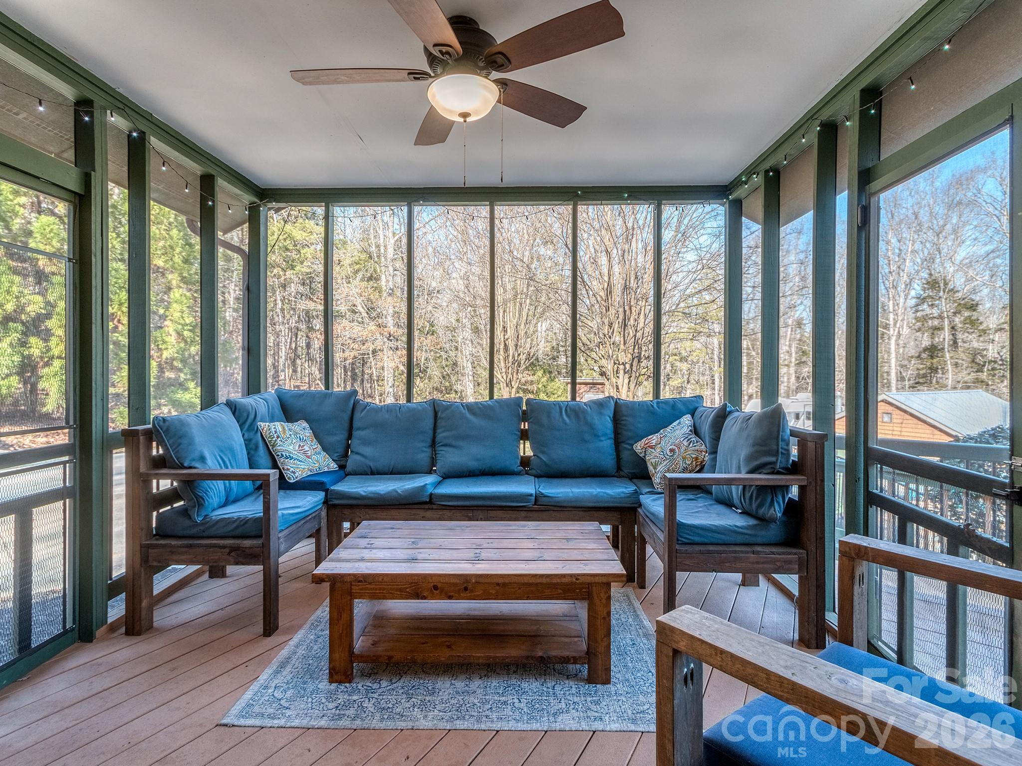 8723 Crestview Road Waxhaw, NC 28173 - Photo 27 of 33 a living room with furniture and a floor to ceiling window