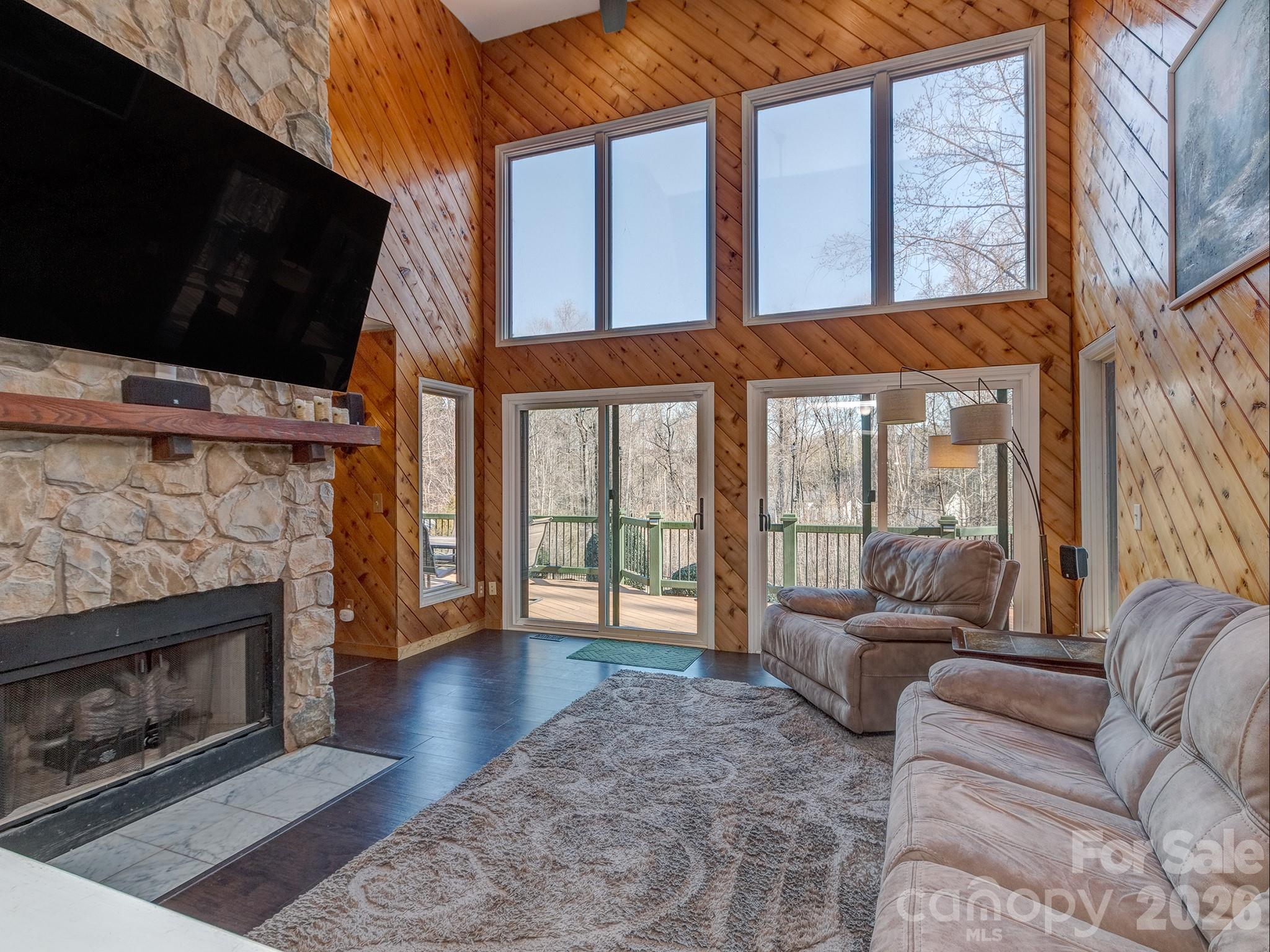8723 Crestview Road Waxhaw, NC 28173 - Photo 5 of 33 a living room with furniture a flat screen tv and a fireplace