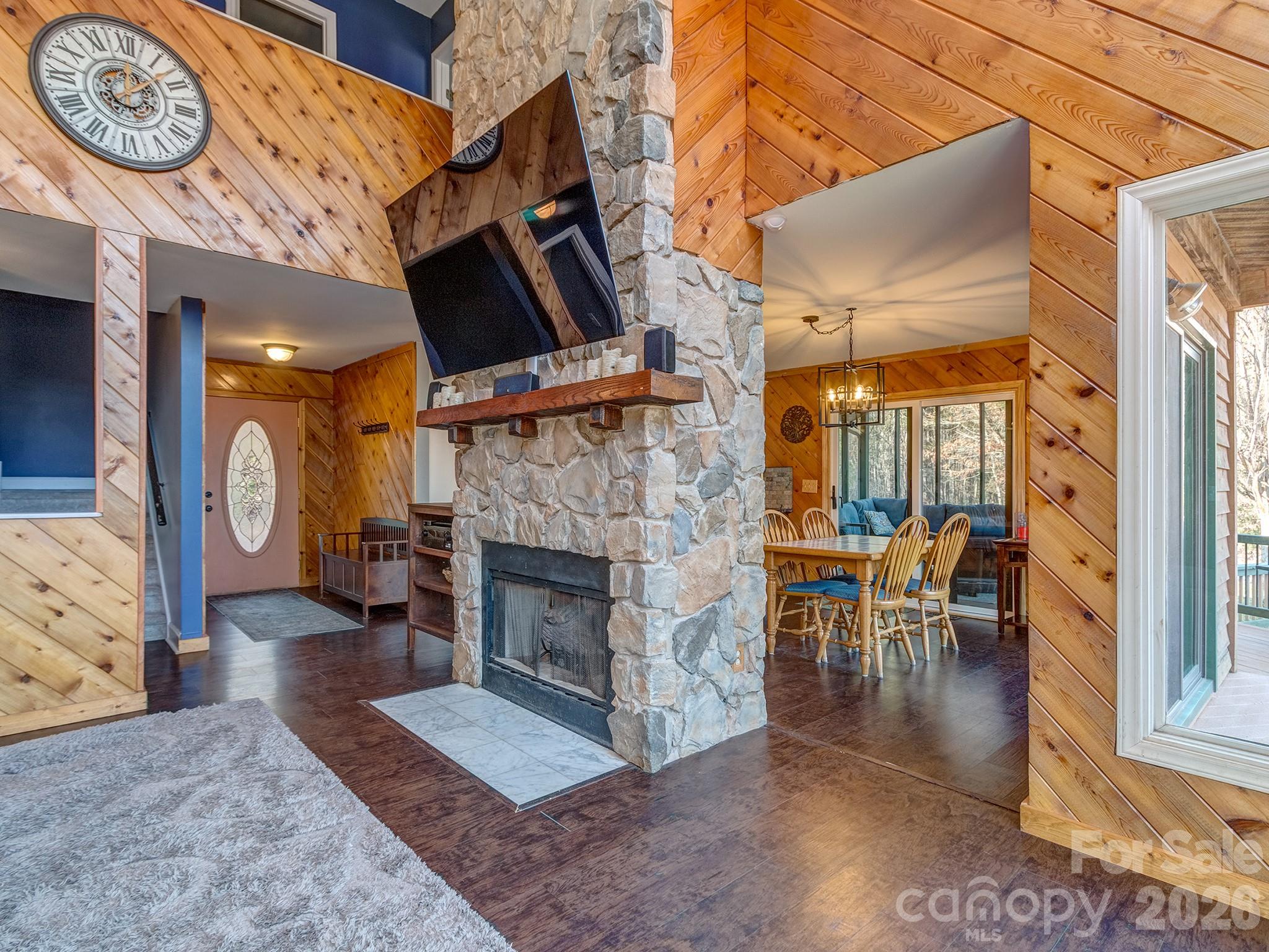 8723 Crestview Road Waxhaw, NC 28173 - Photo 6 of 33 a living room with furniture a flat screen tv and a fireplace