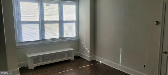 a bathroom with a bathtub and a window
