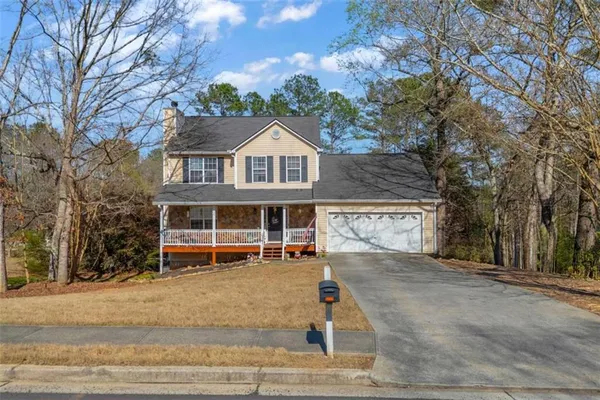 front view of a house with a yard