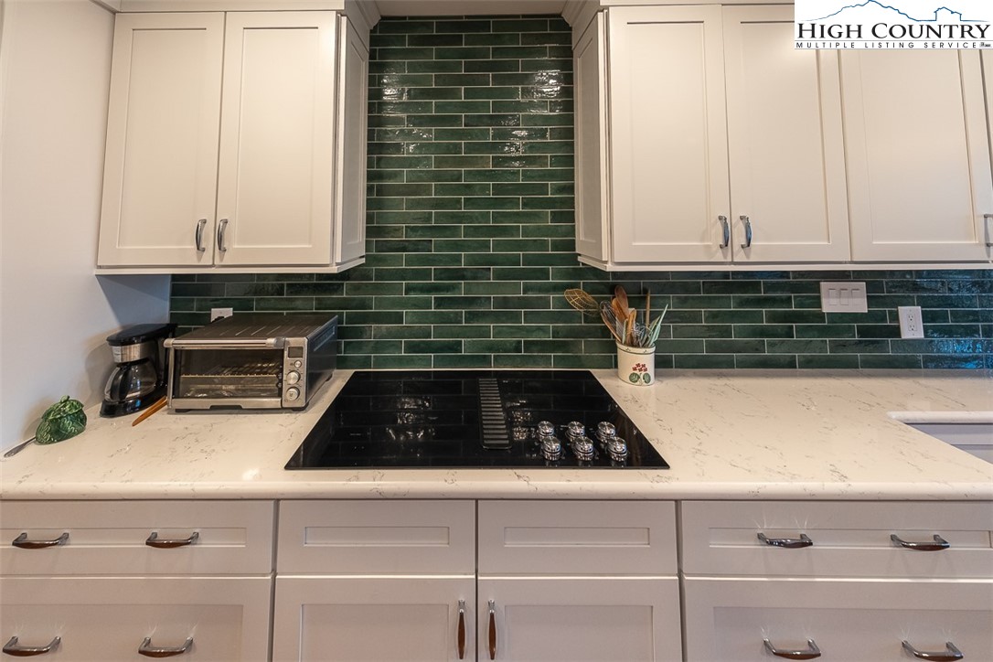 158 Northview Ridge Glade Valley, NC 28627 - Photo 12 of 27 a kitchen with cabinets and a stove top oven