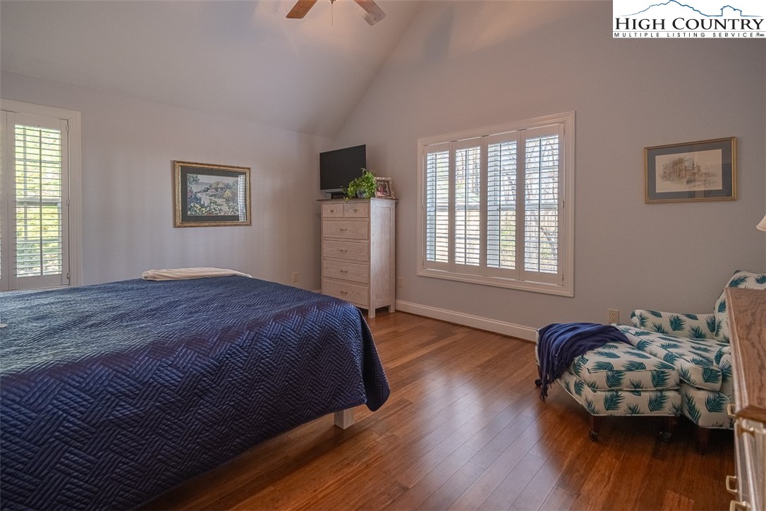 158 Northview Ridge Glade Valley, NC 28627 - Photo 17 of 27 a bedroom with a bed and wooden floor