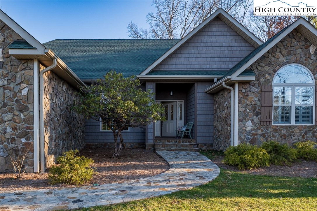158 Northview Ridge Glade Valley, NC 28627 - Photo 2 of 27 a front view of a house with garden
