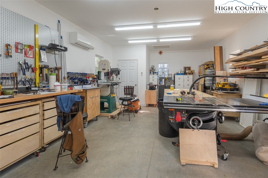 158 Northview Ridge Glade Valley, NC 28627 - Photo 25 of 27 a room with a table chairs and appliances