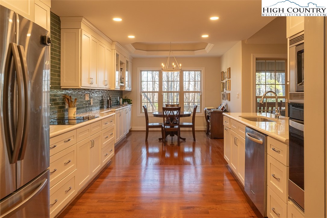 158 Northview Ridge Glade Valley, NC 28627 - Photo 7 of 27 a large kitchen with granite countertop a large counter top appliances and cabinets