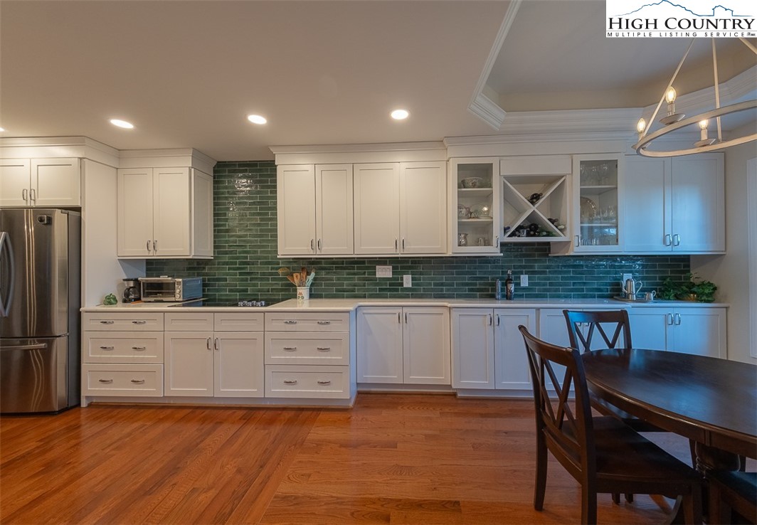 158 Northview Ridge Glade Valley, NC 28627 - Photo 8 of 27 a kitchen with stainless steel appliances granite countertop a stove a sink a dining table and chairs