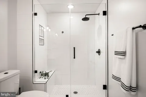 a bathroom with a shower and a toilet