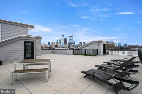 a terrace of a house with outdoor seating