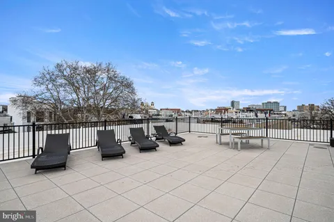 a view of roof with sitting area