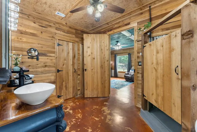 a bathroom with a toilet and shower
