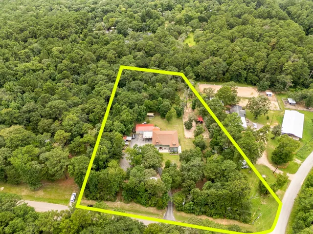 a backyard of a house with lots of green space