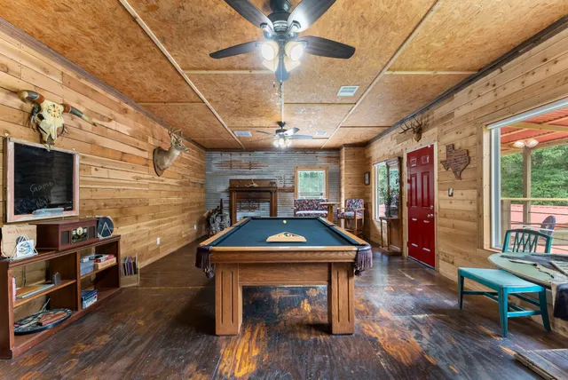 a bathroom with a toilet a sink and shower