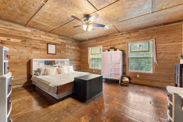 a bathroom with a toilet a sink and shower