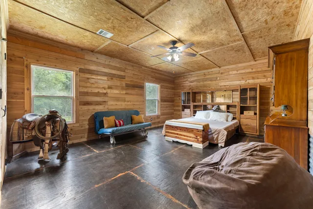 a view of a patio with couches chairs and potted plants