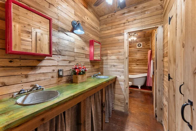 a dining room with furniture wooden floor and a chandelier