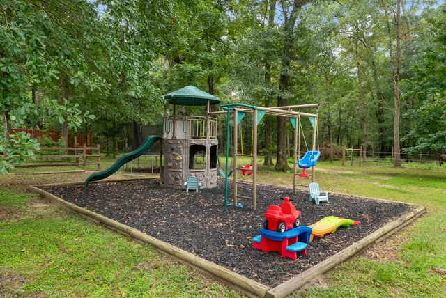 a view of a chair and table on the garden