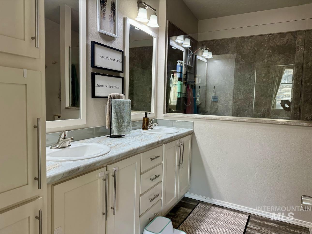 986 Parade Avenue Lapwai, ID 83540 - Photo 10 of 12 Bathroom featuring double vanity and a walk in shower
