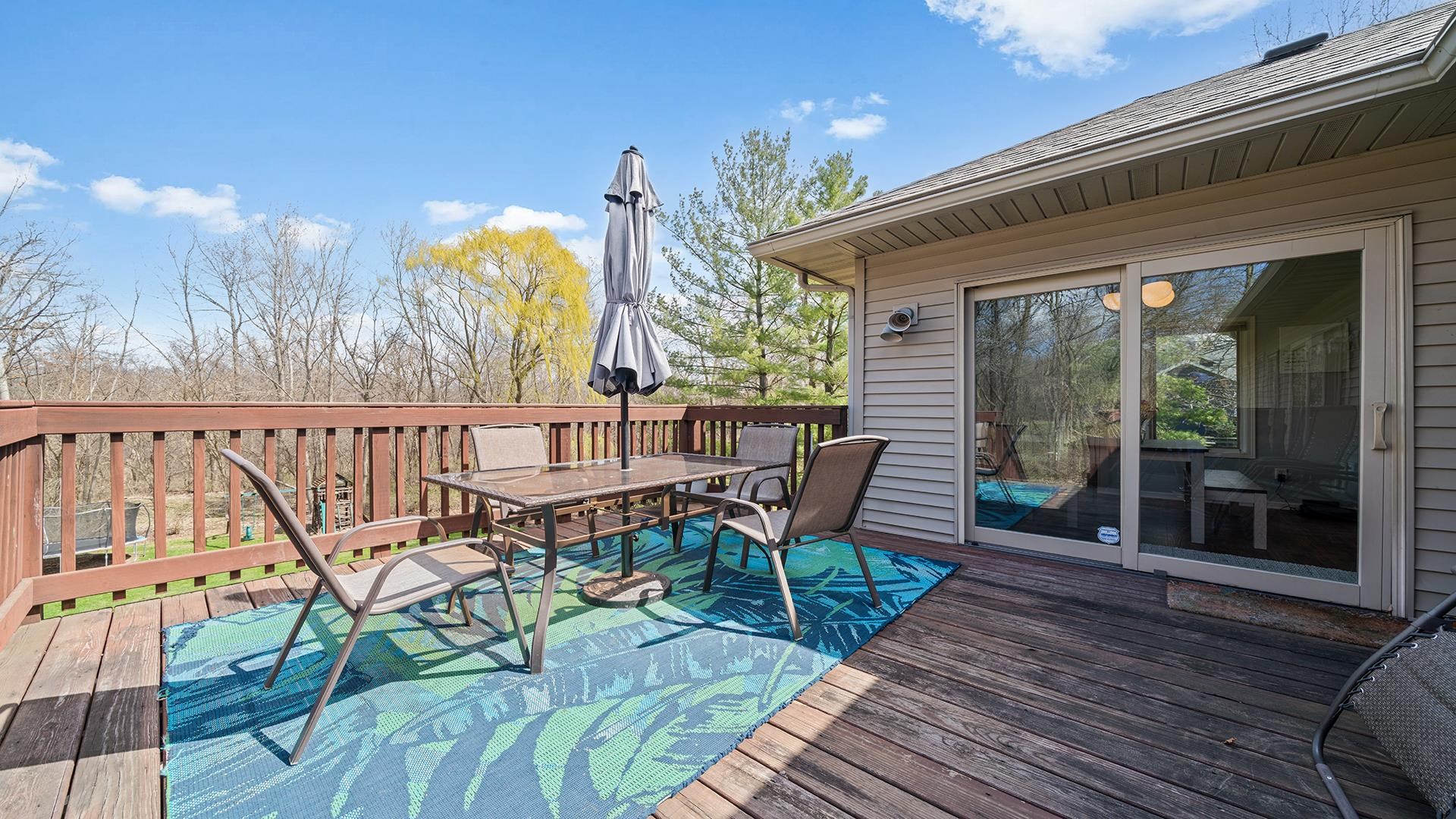 7676 Forest Way Roscoe, IL 61073 - Photo 11 of 56 a view of a chairs and table in the balcony