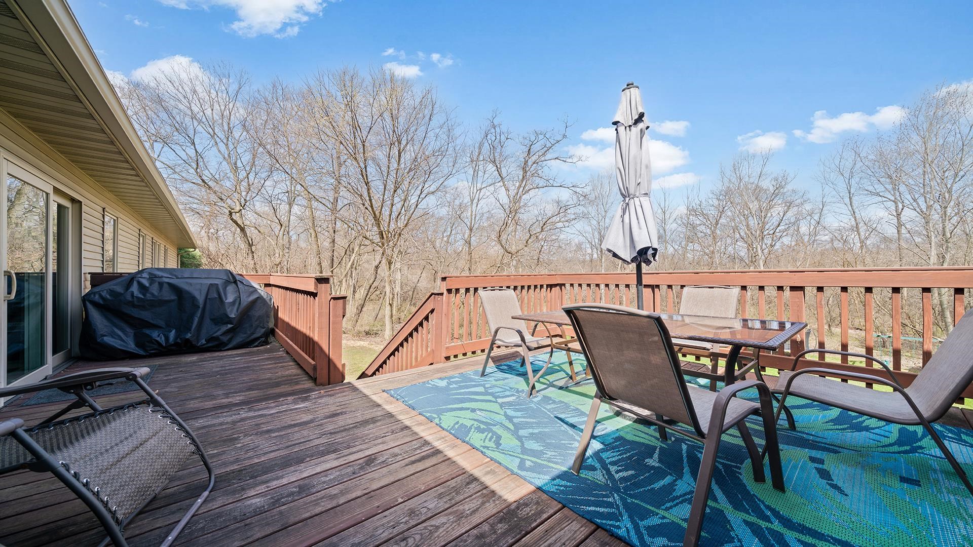 7676 Forest Way Roscoe, IL 61073 - Photo 13 of 56 a view of a chairs on the roof deck