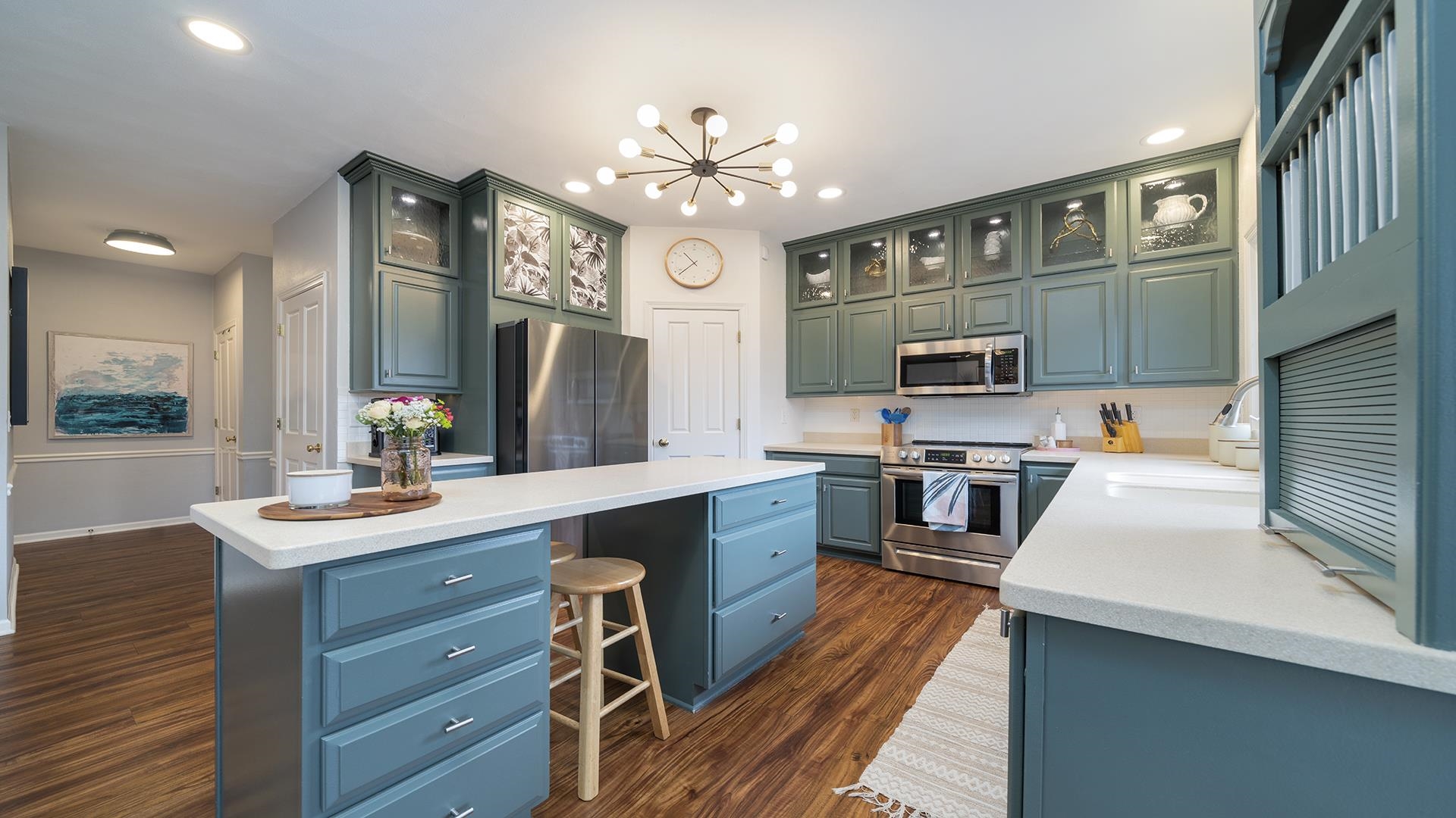 7676 Forest Way Roscoe, IL 61073 - Photo 16 of 56 a kitchen with wooden cabinets and stainless steel appliances
