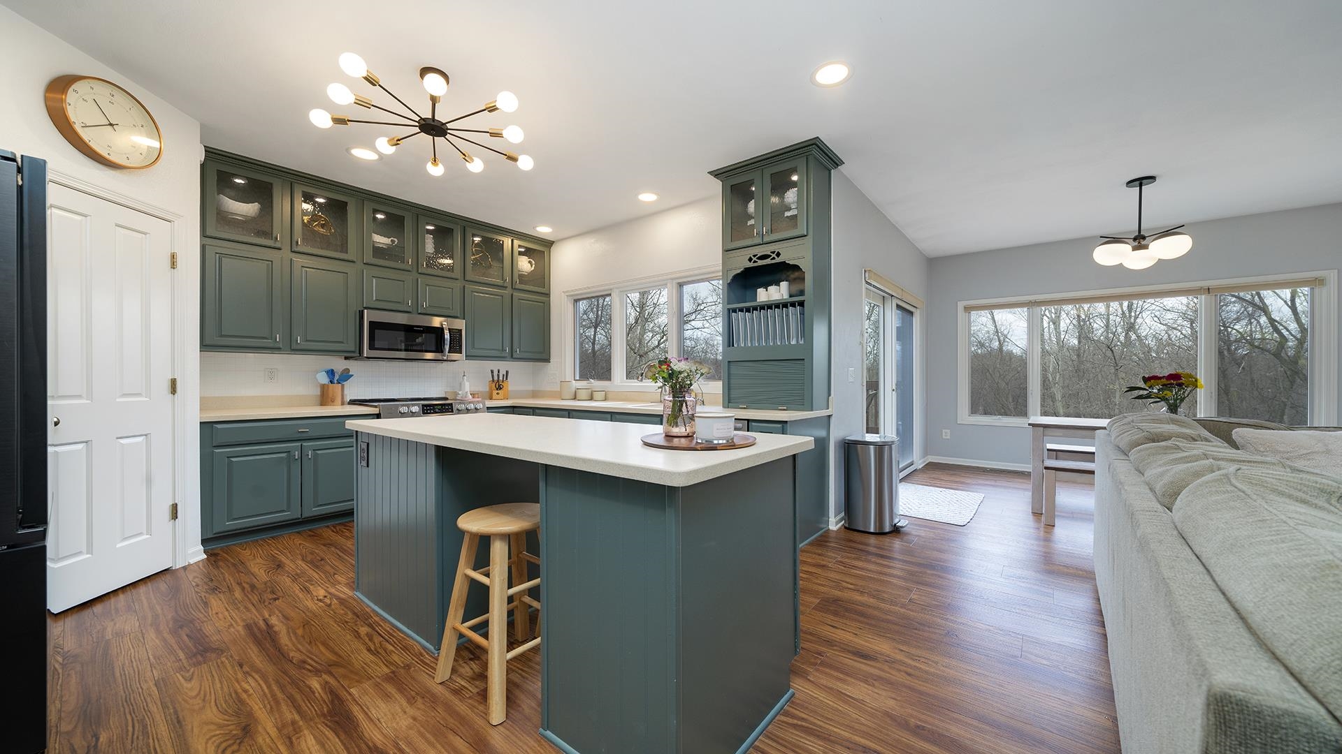 7676 Forest Way Roscoe, IL 61073 - Photo 18 of 56 a kitchen with kitchen island a sink appliances and cabinets