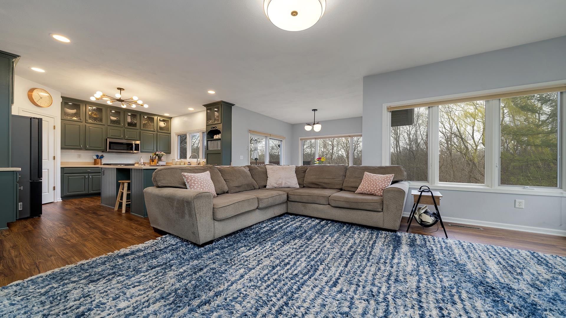 7676 Forest Way Roscoe, IL 61073 - Photo 21 of 56 a living room with furniture and a large window