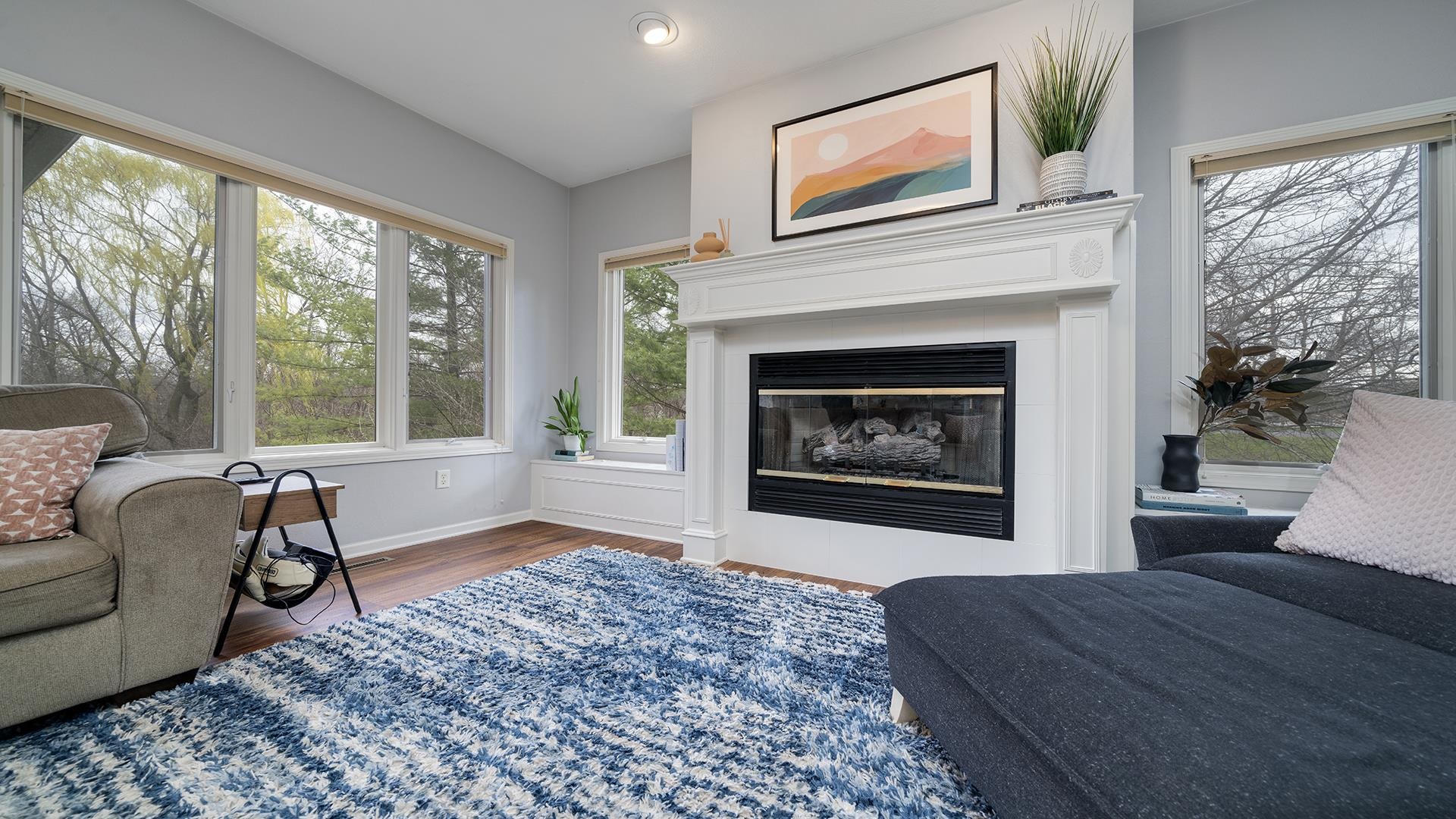 7676 Forest Way Roscoe, IL 61073 - Photo 22 of 56 a living room with furniture and a fireplace
