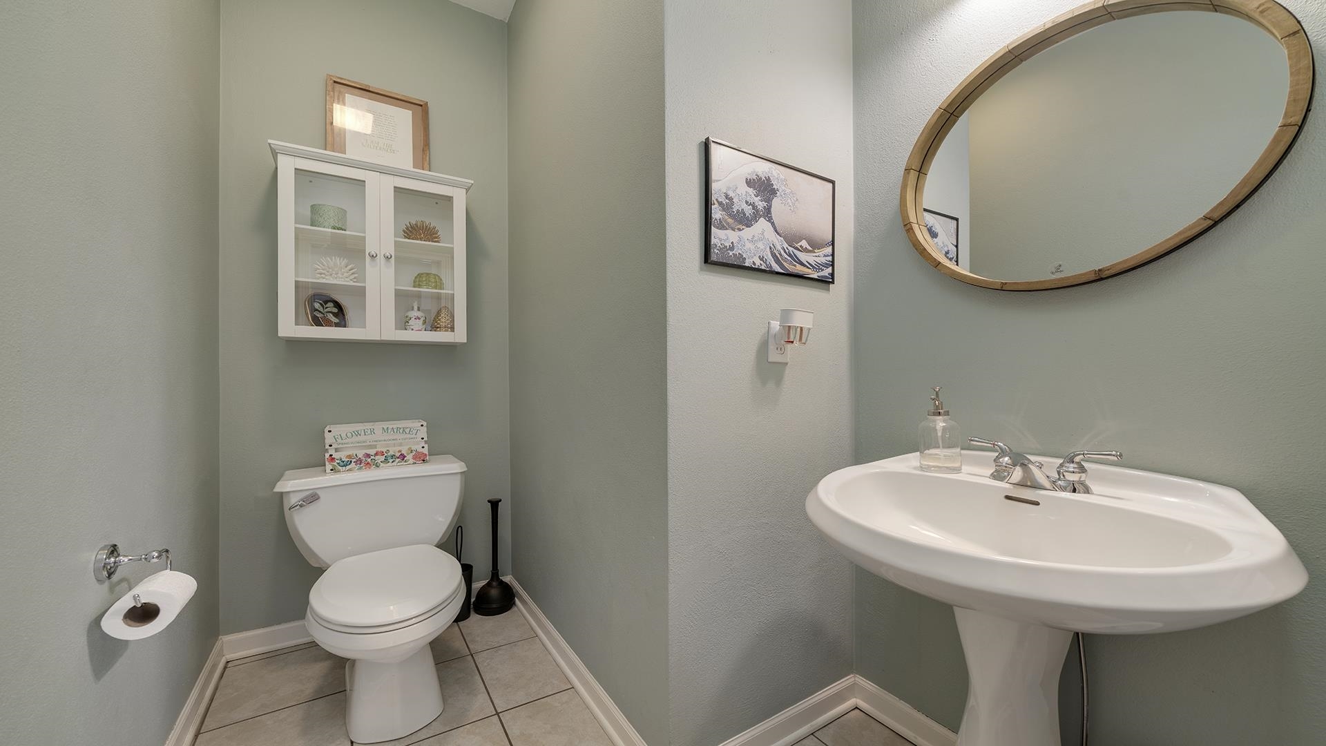 7676 Forest Way Roscoe, IL 61073 - Photo 24 of 56 a bathroom with a toilet a sink and mirror