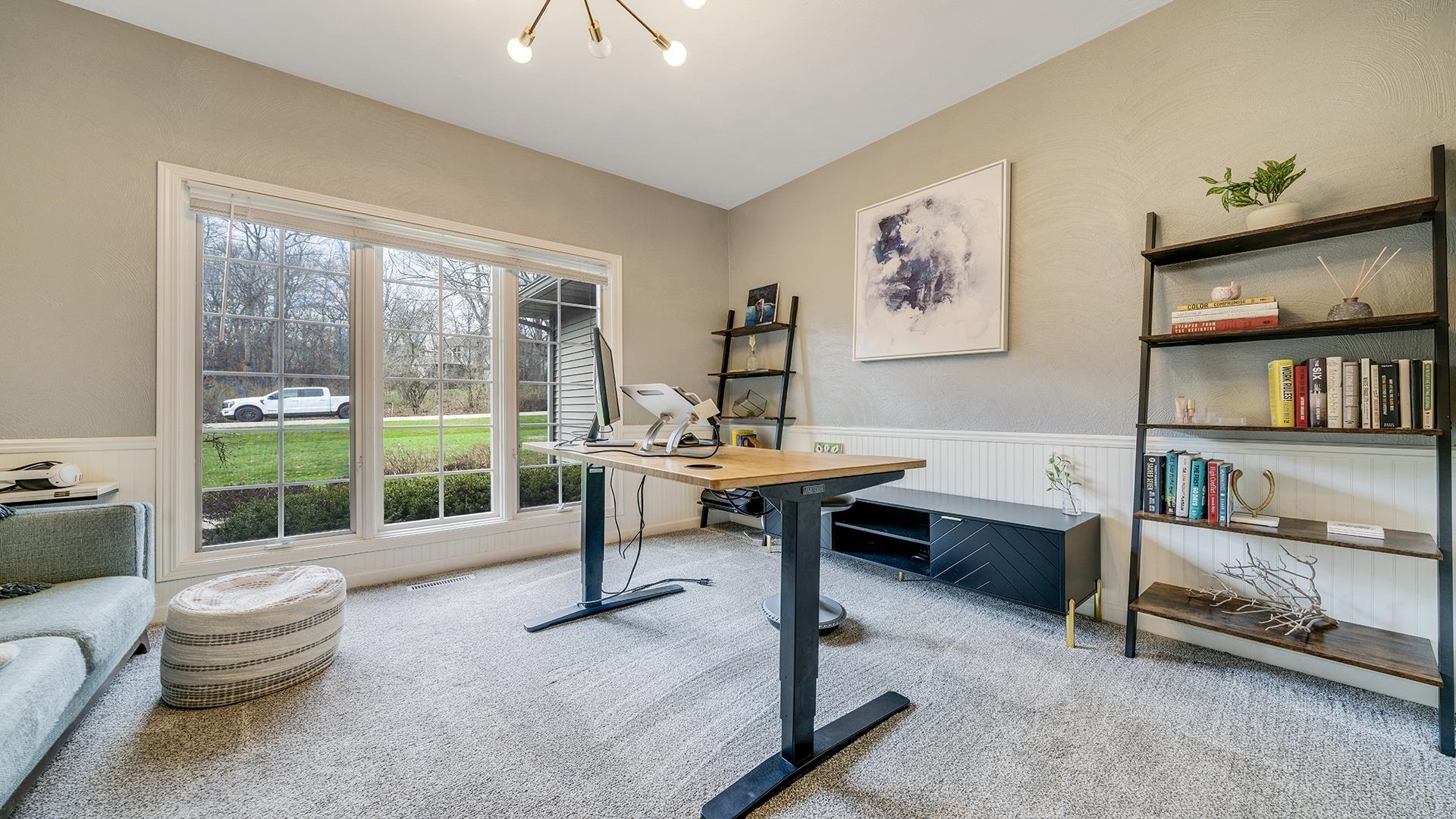 7676 Forest Way Roscoe, IL 61073 - Photo 35 of 56 a living room with furniture a rug and a large window