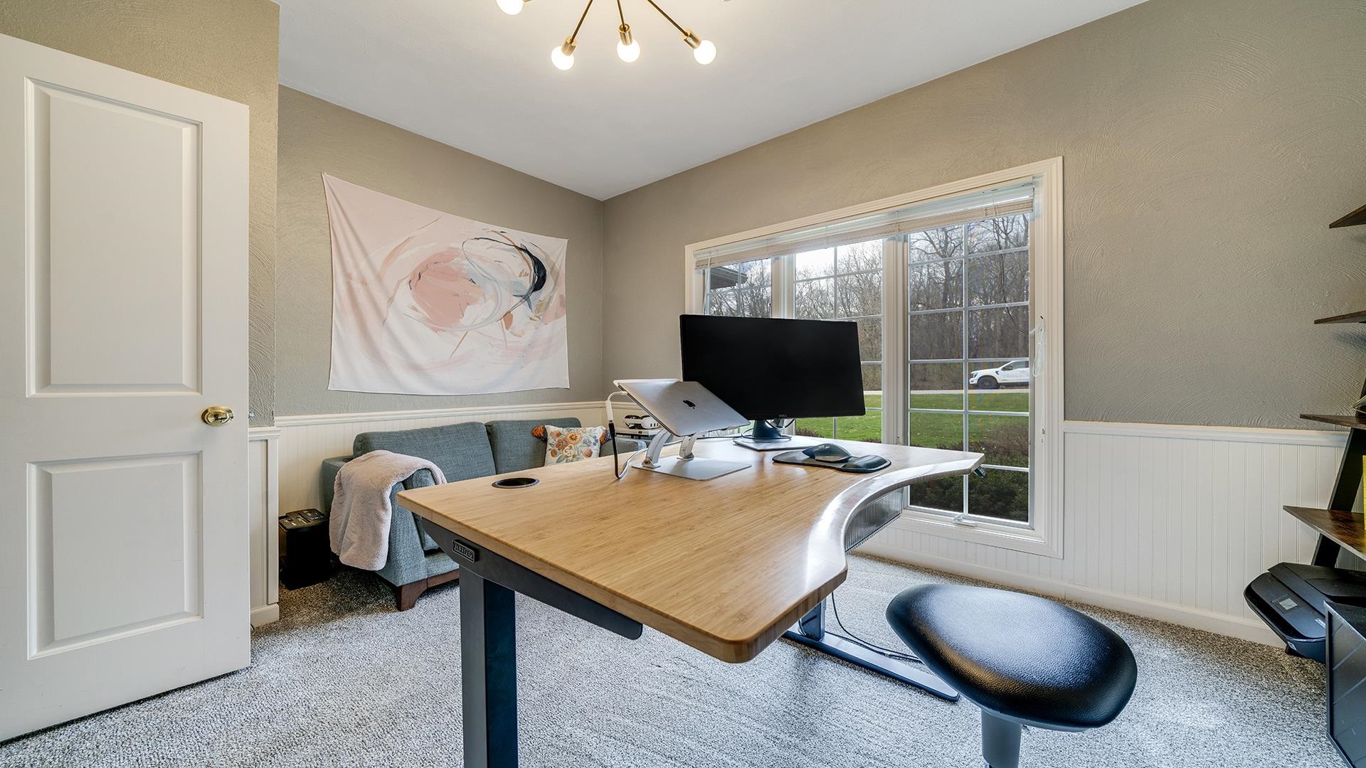 7676 Forest Way Roscoe, IL 61073 - Photo 36 of 56 a room with furniture and a flat screen tv