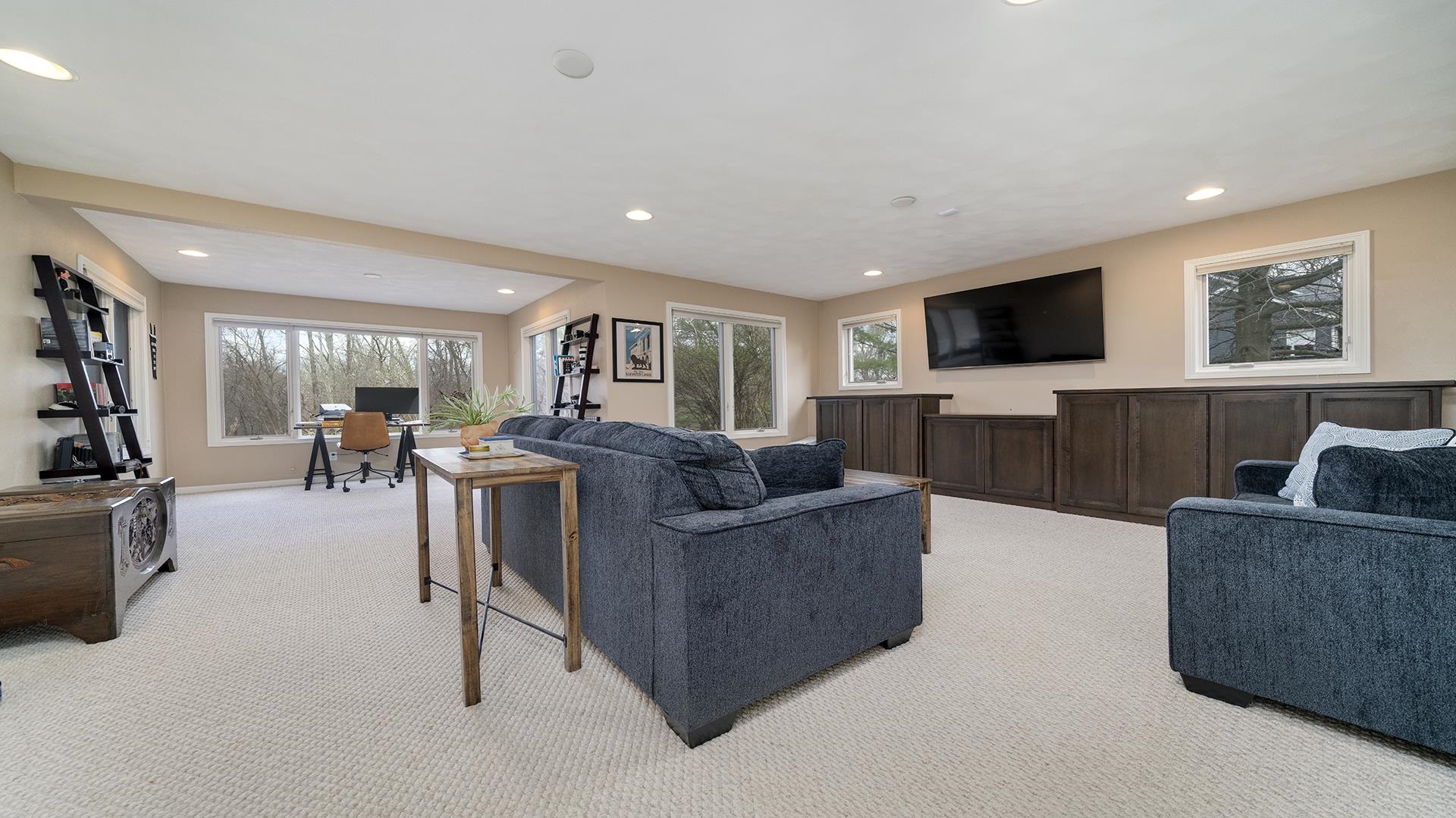 7676 Forest Way Roscoe, IL 61073 - Photo 37 of 56 a living room with furniture and a flat screen tv