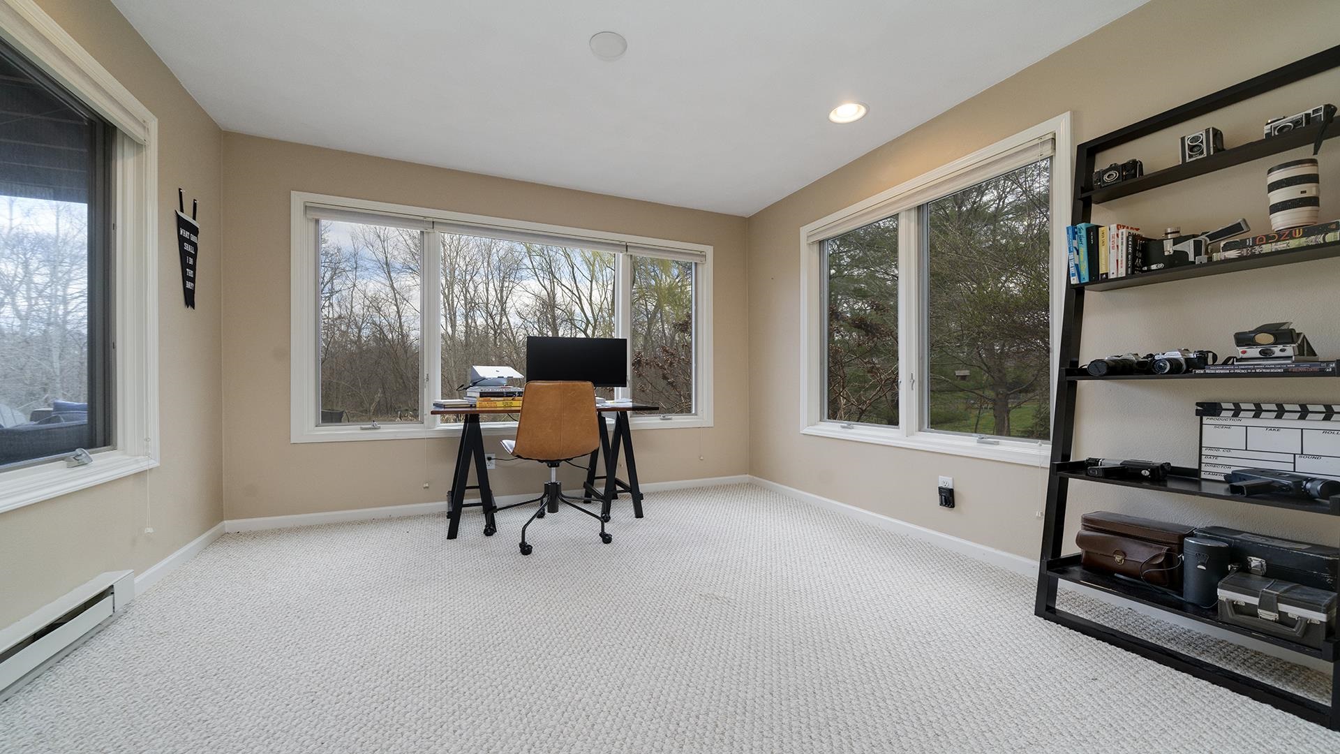 7676 Forest Way Roscoe, IL 61073 - Photo 40 of 56 a dining room with furniture and a floor to ceiling window