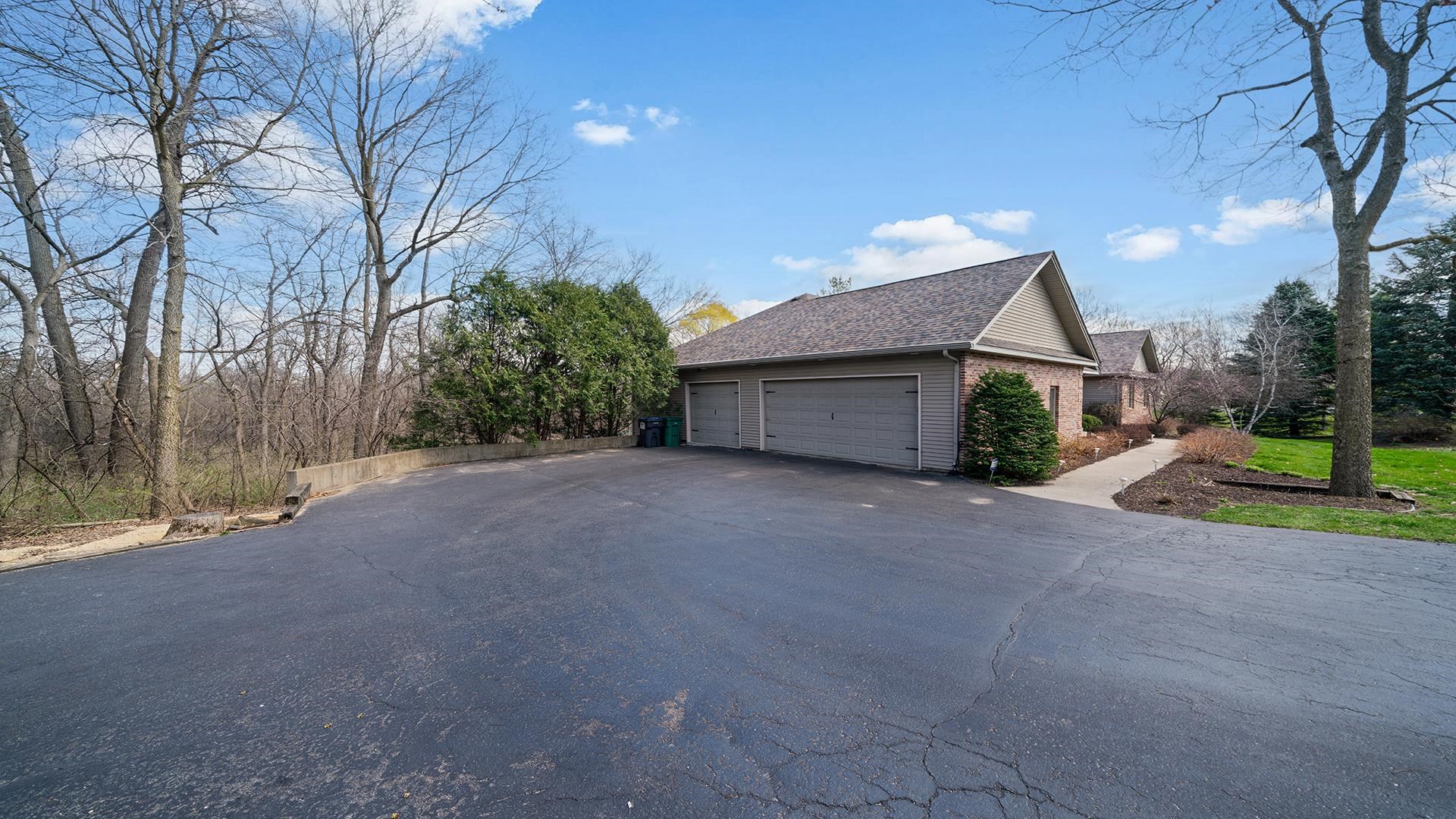 7676 Forest Way Roscoe, IL 61073 - Photo 4 of 56 a house view with a outdoor space